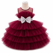 Red tiered dress with a silver bow on a mannequin against a white background