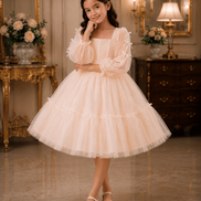 Young girl in a white dress standing in an elegant room with decorative furniture and flowers.