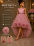 Pink tulle dress with detachable bow on a model, set against a decorative background.