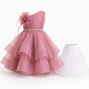 Pink one-shoulder dress with a flower detail on a white background