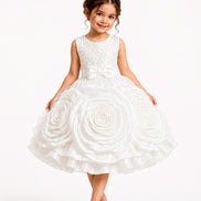 Young girl wearing a white floral dress with a tiara on a white background