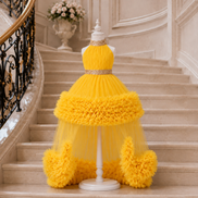 Yellow dress on a mannequin against a staircase background