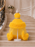 Yellow dress on a mannequin against a staircase background